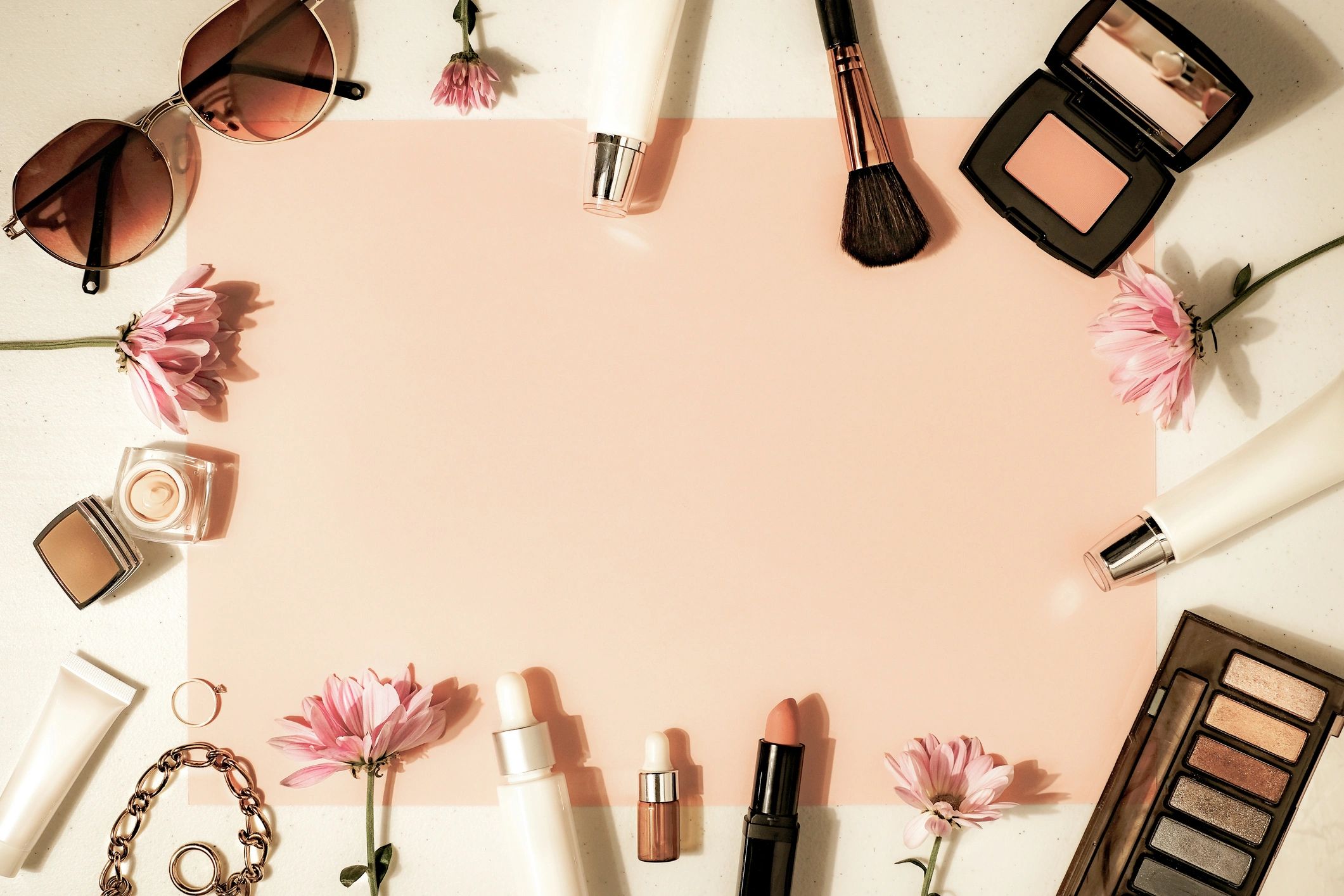 Luxury beauty products styled on a soft flatlay