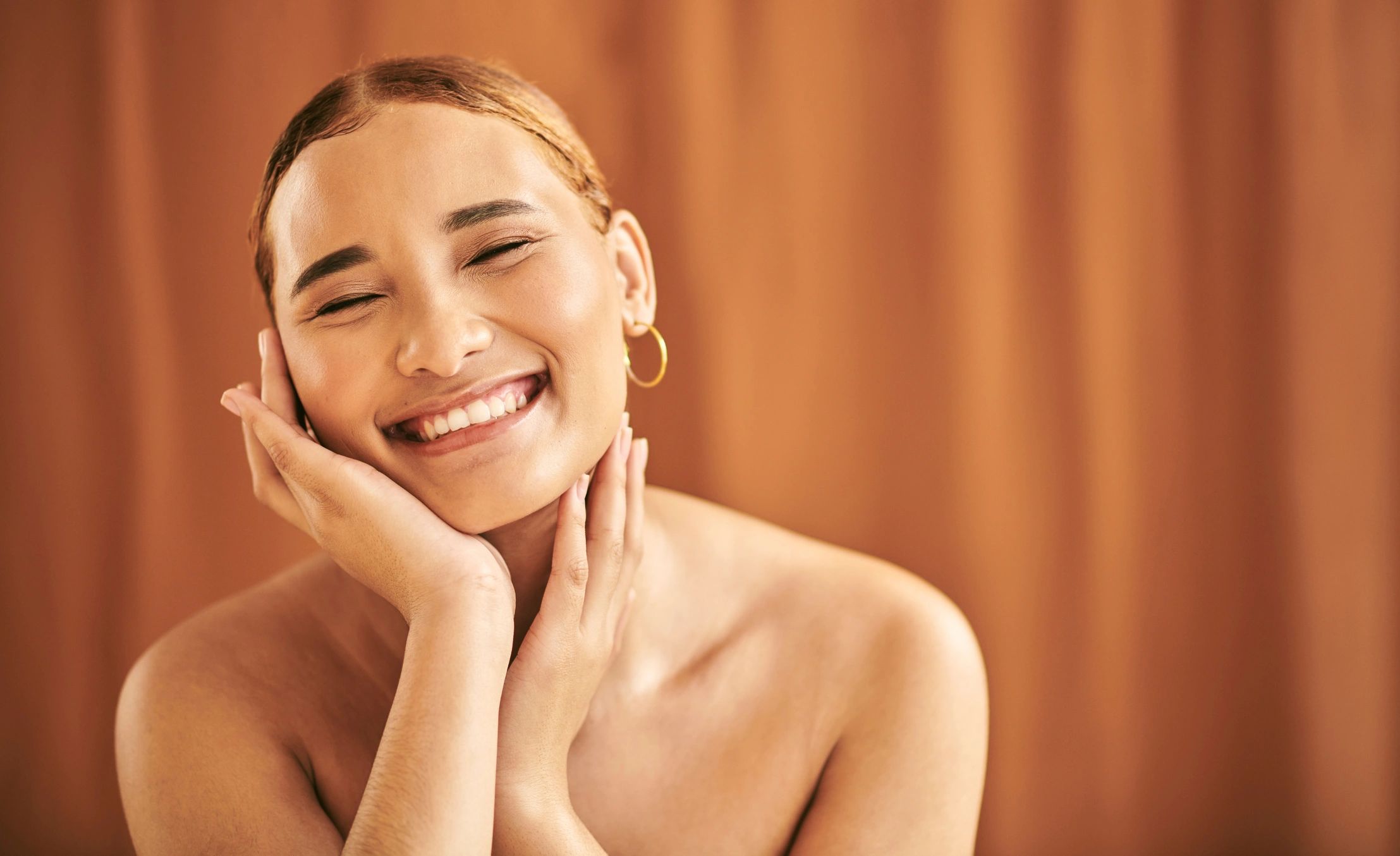 Beauty, skincare and portrait of a smiling woman with hands framing her face