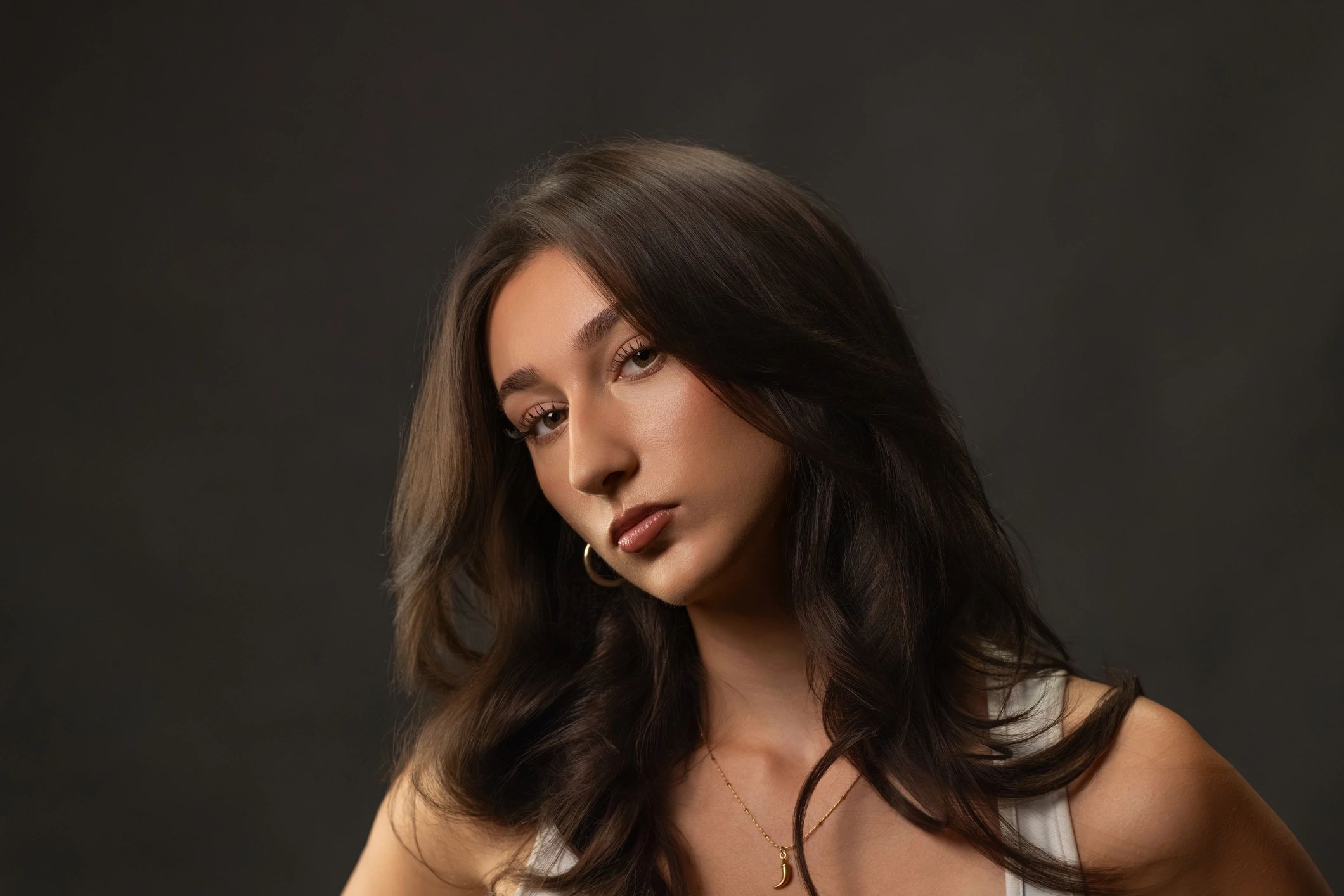 Young woman posing for studio fashion beauty portrait